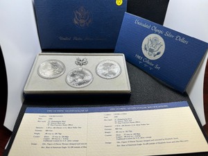 lot 12 image: 1983  U.S. Mint Collector Set of 3 Uncirculated P- D- S Olympic Comm. Silver Dollars in Original Mint box with COAs