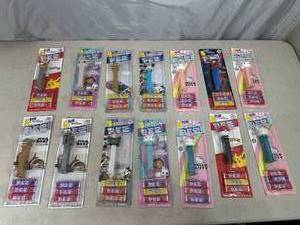 lot 37 image: 14 New Pez Dispenser Candy Toys - Hello Kitty, Spiderman, Star Wars, Pokemon, and More