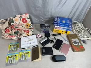 lot 68 image: Power Banks, Hand Warmer, Luce Facial Cleanser, Blank VHS, and More