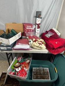 lot 90 image: Large Totes of Holiday Christmas Items, Lights, Towels, Glasses, and More