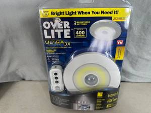 lot 209 image: New Over Lite Remote Controlled  Motion Activated Light Fixture