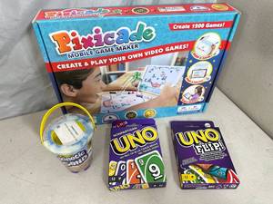 lot 265 image: New Pixicade Mobile Game Maker, Kinetic Sand, Uno Card Games