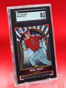 lot 85 image: 2011 Topps Finest Mike Trout Rookie Card #94 Near Mint-Mint SGC 8