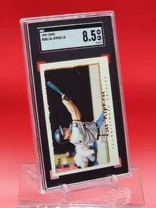 lot 111 image: 1995 Topps Baseball Cal Ripken Jr Card #588 Near Mint-Mint SGC 8.5