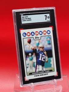 lot 94 image: 2008 Topps Football Tom Brady League Leaders Card #286 Near Mint SGC 7