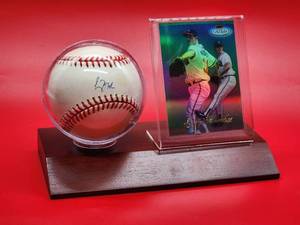 lot 39 image: Autographed Baseball by Atlanta Braves HOF Great Greg Maddux with COA and Baseball Card