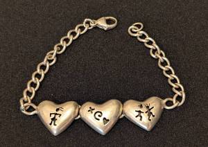 lot 107 image: LL - Sterling Silver 7 Inch Heart Link Bracelet with Tribal Designs