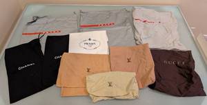 lot 64A image: LL - Collection of Designer Dust Bags Chanel Prada Louis Vuitton Gucci Assorted Styles