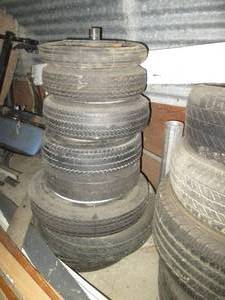 lot 120 image: Stack of assorted size trailer tire...
