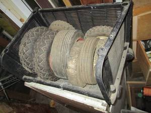 lot 51 image: Bin full of assorted wheels for ite...