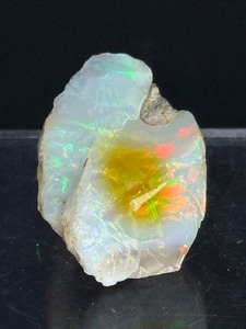 lot 50 image: Breathtaking Ethiopian Welo Opal 6 gm  .2 oz is a relatively new type of opal discovered in mountainous regions of northern Ethiopia, the Wollo Province. Symbolize passion, warmth, & love.