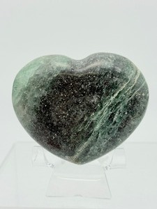 lot 126 image: Very Pretty Fuchsite Heart 263 gm.  9.0 oz. Also known as chrom mica or green muscovite, it a green, chromium-rich variety of the mineral muscovite.  Popular for its shimmering appearance.