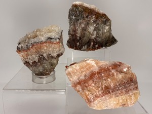 lot 47 image: Tri-colored Calcite Chunks Lot of 3  2 kilo 359 gm  5 lb. 3.2 oz.  Is a natural form of banded calcite that display 3 distinct layers of color. UV reactive