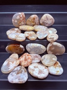 lot 277 image: Lovely 12 kilo polished flower agate palmstones