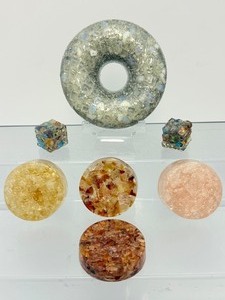 lot 296 image: Orgonite Lot of 7 Donut, 2 Die, and 4 circles.  Composed of metal shavings, crystals and resins. EMT protection