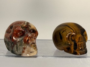 lot 159 image: Skulls, Lot of 2 Red Jasper with hematite 106gm3.7oz   Tigers Eye 87gm3oz.