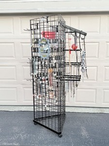 lot 73 image: Triangle Black Wire Grid Tower with Base and Casters included attached mirror.  Jewelry and grid accessories not included. Will be sold in Part 3 of this auction.