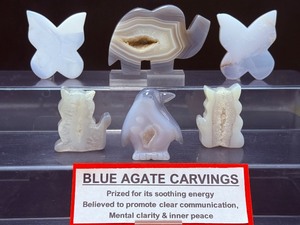 lot 127 image: Blue Agate Polished Carvings Lot of 6 elephant, 2 butterflies, 2 cats & a penguin 375 gm.  13.2 oz.