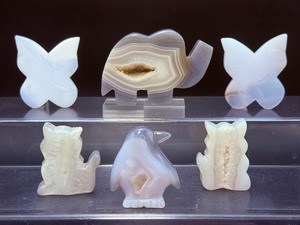 lot 127 image: Blue Agate Polished Carvings Lot of 6 elephant, 2 butterflies, 2 cats & a penguin 375 gm.  13.2 oz.