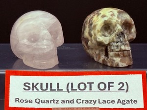 lot 181 image: Crazy Lace Agate Skull 88 gm  3.1 oz and Rose Quartz Skull 96 gm  3.3 oz.Total Weight 183 gm  6.4 oz