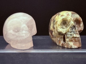 lot 181 image: Crazy Lace Agate Skull 88 gm  3.1 oz and Rose Quartz Skull 96 gm  3.3 oz.Total Weight 183 gm  6.4 oz