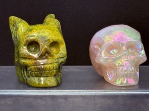 lot 130 image: Rainforest Jasper Guardian Skull & Aura Rose Quartz Skull RF Jasper 117 gm  4.1 oz. Aura Rose Quartz 96 gm.  3.3 oz. Total Weight 212 gm.  7.4 oz.