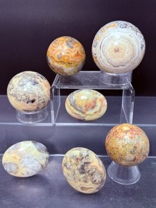 lot 193 image: Crazy Lace Agate Polished Lot of 7  sphere 47mm 165 gm  5.8 oz., sphere 43mm 134 gm  4.6 oz., sphere 38mm 89 gm  3.1 oz., sphere 38mm, 93 gm  3 oz. Total Weight 592 gm  1 lb. 5 oz.