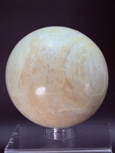 lot 61 image: Large Mangano Calcite Sphere 99 mm  1.5 kilo  1 lb. 12.6 oz. isi a rare variety of pale pink calcite and is famously mined in Peru.