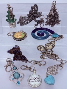lot 294 image: Hanging Charms 3 Christmas, 2 butterflies and 5 misc. Great for backpacks, purses, keychains, cars, windows, stocking stuffers & more