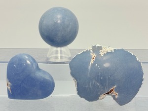 lot 281 image: Angelite Lot of 3 Sphere 44mm, 160 gm  5.6 oz.  Heart 95gm  3.3 oz.  12 tumbled chunk 258 gm  9.1 oz.  Total Weight 514 gm  1 lb.  2.6 oz . Reflects its angelic connotations.