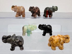 lot 220 image: Gemstone Elephants Lot of 7  1 Tiger Eye, 1 Larvikite, 1 Amazonite, 1 Unakite, 1 Rhodonite, 1 Moss Agate, 1 Black Obsidian, and 1 Bloodstone.