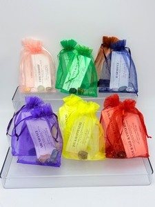 lot 301 image: Crystal Gemstone Intention Bags Lot of 12 1-stability, 1-harmony, 2-joy & happiness, 2-opportunity & success, 2-friendship, 2-abundance, and 2-courage & confidence. Each bag contains the stones of the bags intention