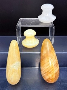 lot 222 image: Massage Tools Lot of 4 Massage tools Polished Lot of 4 2 wands (calcite) and 2 mushroom-shaped facial massage tools (calcite & whitei jade)