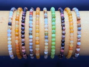 lot 95 image: 4 mm Bracelets lot of 10     3 Yellow Jade, 2 Rhodonite, 2 Bamboo Leaf, 1 Chinese Jade and 2 Laguna Lace Agate