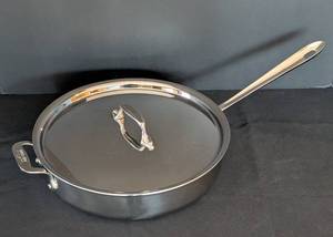 lot 127 image: K - All-Clad 3 Qt Stainless Steel Saute Pan with Lid, 11 Inch