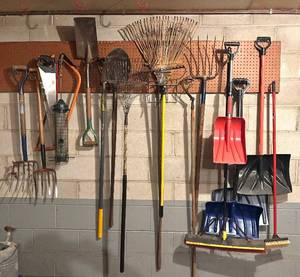 lot 219H image: G - Large Collection of Yard and Snow Tools with Rakes, Shovels, and Saws