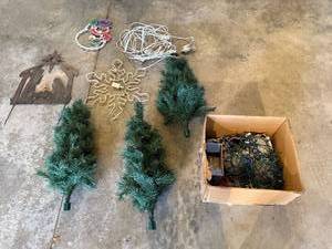 lot 32 image: Collection of Holiday Outdoor Decorations with Mini Trees, Lights, and Metal Nativity Scene