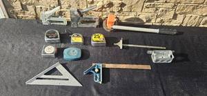 lot 79 image: Collection of Hand Tools Including Tape Measures, Squares, and Staplers