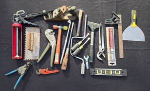lot 95 image: Assorted Hand Tool Collection including Caulking Gun, Level, and Screwdrivers