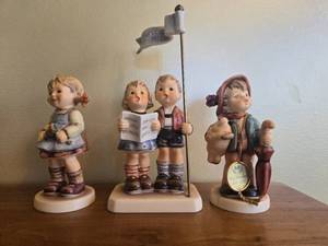 lot 120 image: Set of 3 Goebel Hummel Figurines M.I. Hummel Club Limited Editions