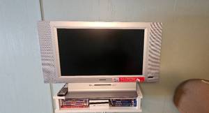 lot 127 image: NICE Magnavox 26 HDTV with Built-In DVD Player and Disney DVD Collection