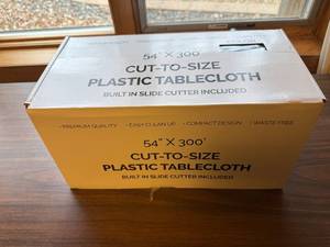 lot 168 image: 54in Cut-to-Size Plastic Tablecloth with Built-in Slide Cutter