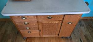 lot 192 image: Vintage Oak Kitchen Cabinet with Drawers and Rolling Castors 32x48x27 Inches