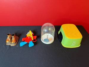 lot 219 image: Vintage BabyBjorn Step Stool, Child Figurine Purse, Boot Bookends, and Plastic Dome Collection