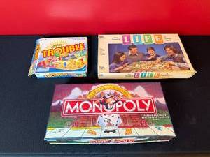 lot 229 image: Collection of 3 Used Classic Board Games Monopoly Deluxe, The Game of Life, Trouble