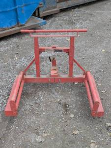 lot 38 image: 34 Ton Red Wheeled Dolly - Raise to the Occasion
