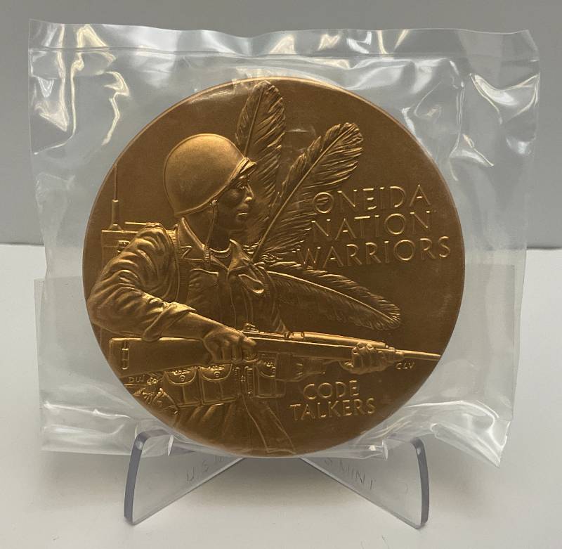 lot 2 image: Est. $100.00 - $199.00 2014 US Mint Oneida Nation Code Talkers Commemorative 3 Bronze Medal With Box And Stand (New In Factory Sealed Bag)
