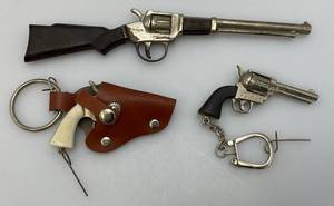 lot 141 image: Three Vintage Miniature Cap Guns