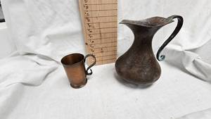 lot 22 image: Vintage Hammered Copper Pitcher and Glencraft Copper Stein