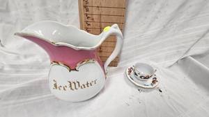 lot 203 image: Porcelain Ice Water Pitcher and Tea Cup and Saucer Set